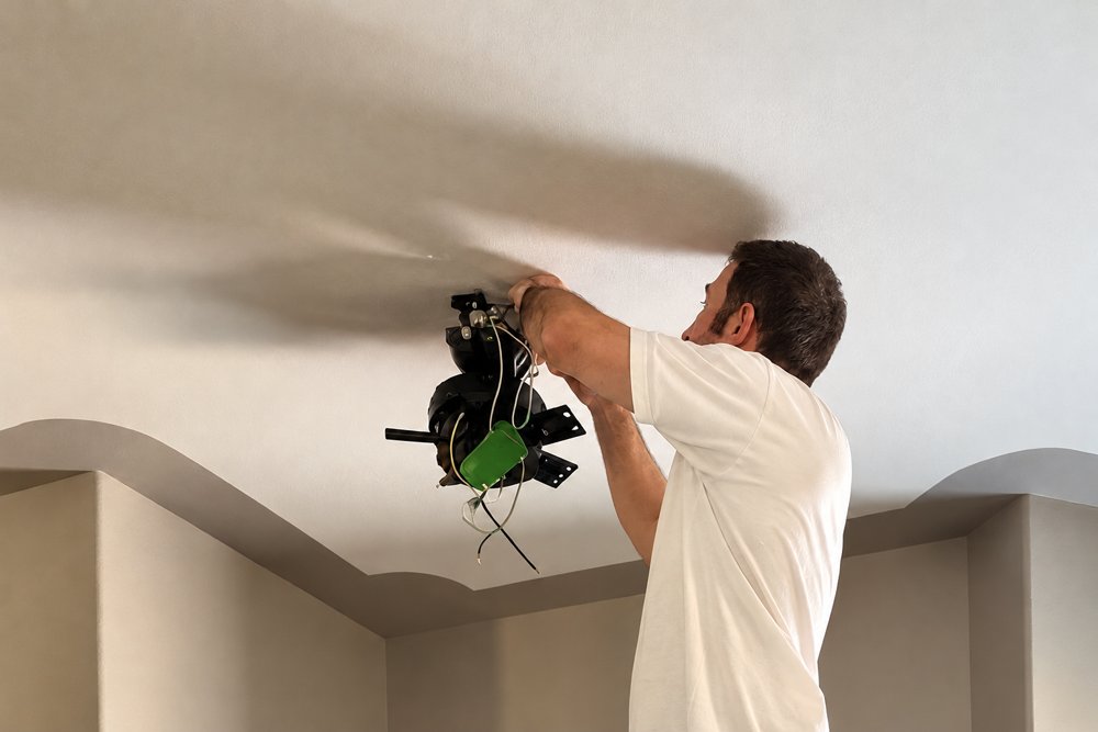 Close-up of ceiling fixture work in progress